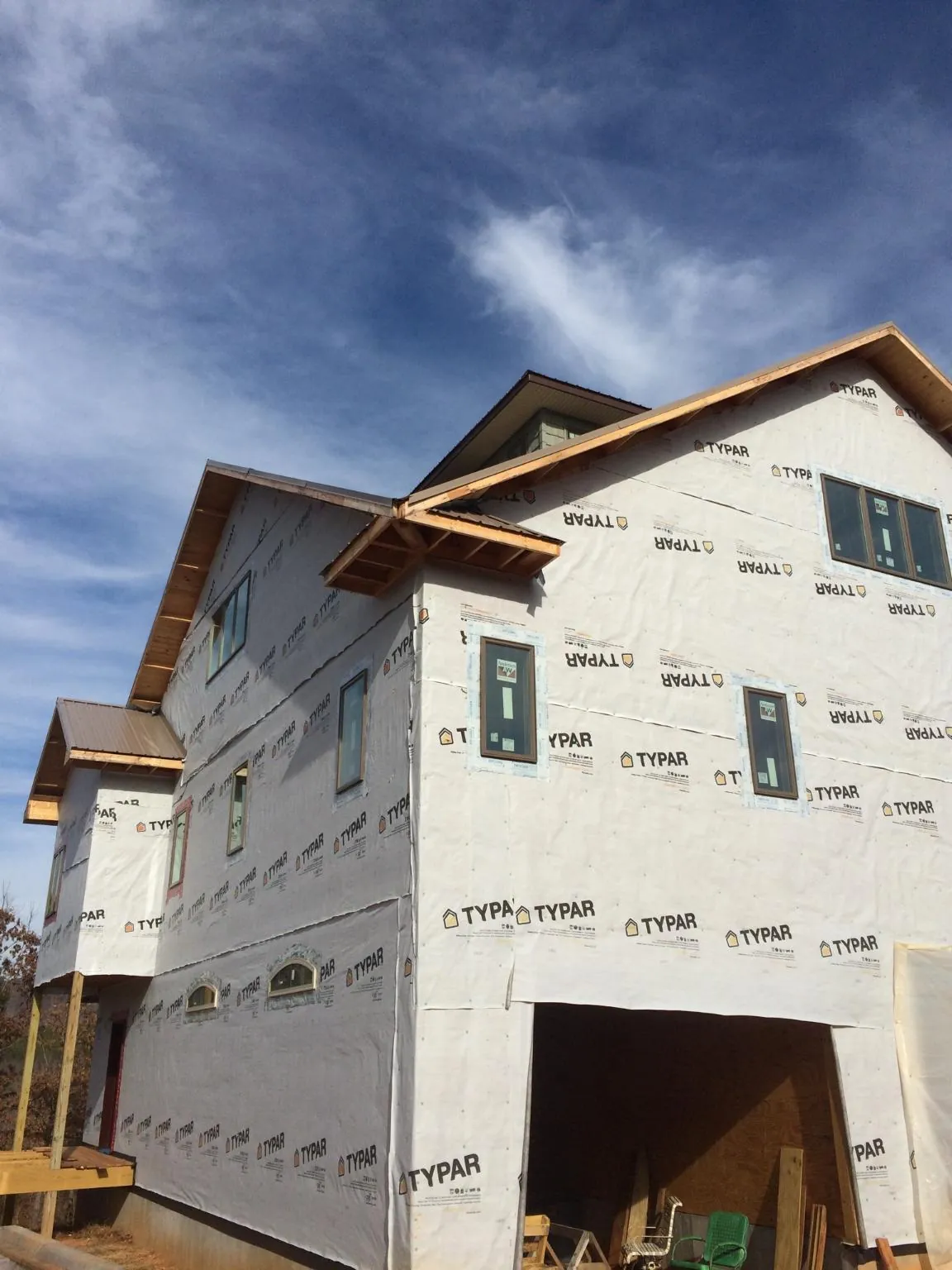 Stick built house wrapped in Typar with new roof framing and dormers in Meherrin